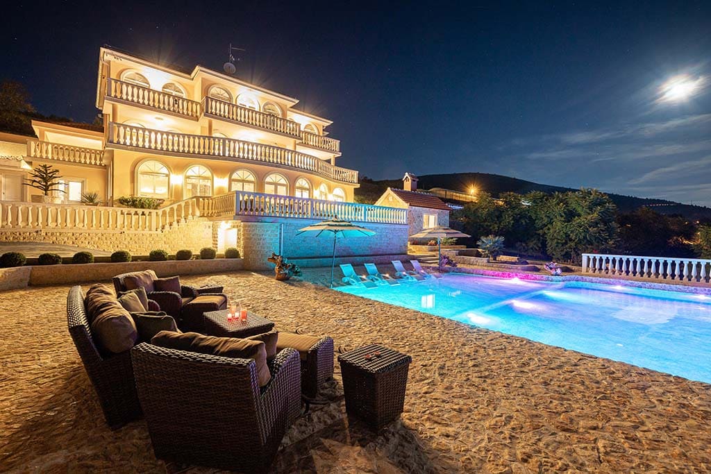 Luxury villa citrine pool at night